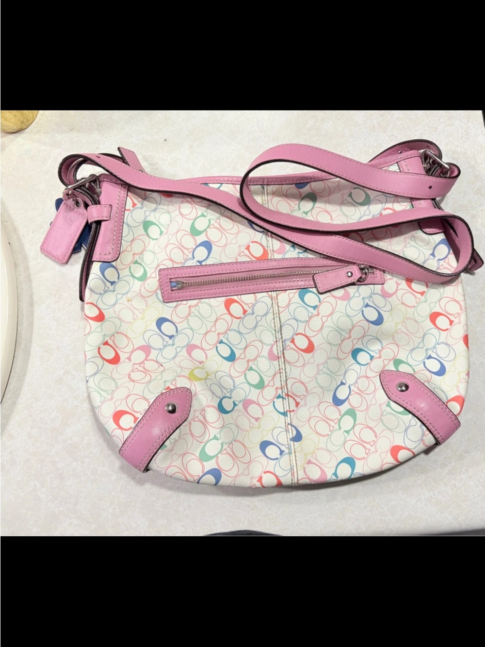 Coach Multicolor Signature Print Crossbody with Pink Trim.